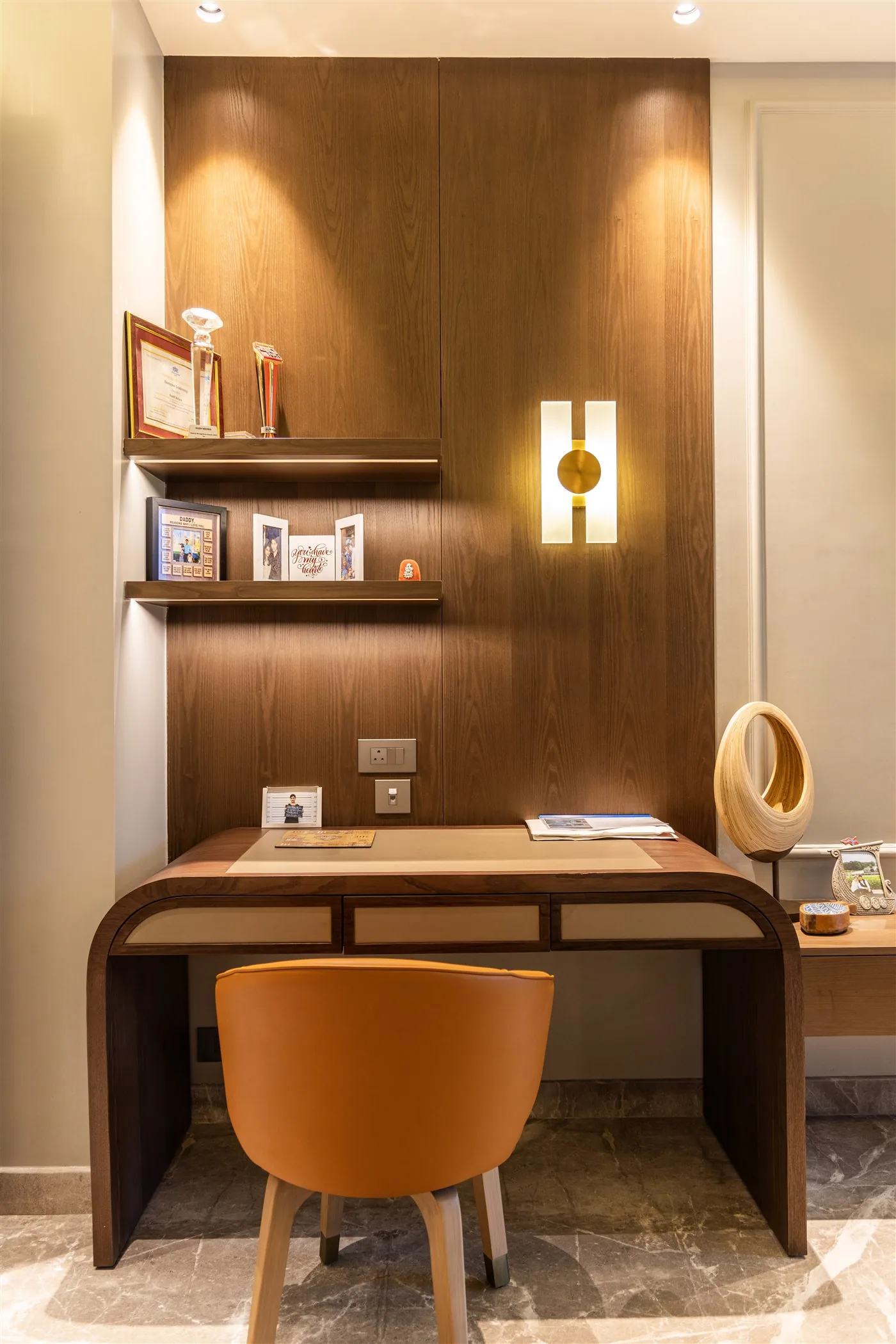 Study desk with panelled wall and shelving