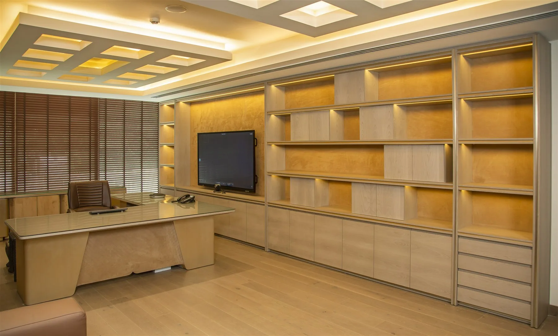 Office wall with display shelving and storage