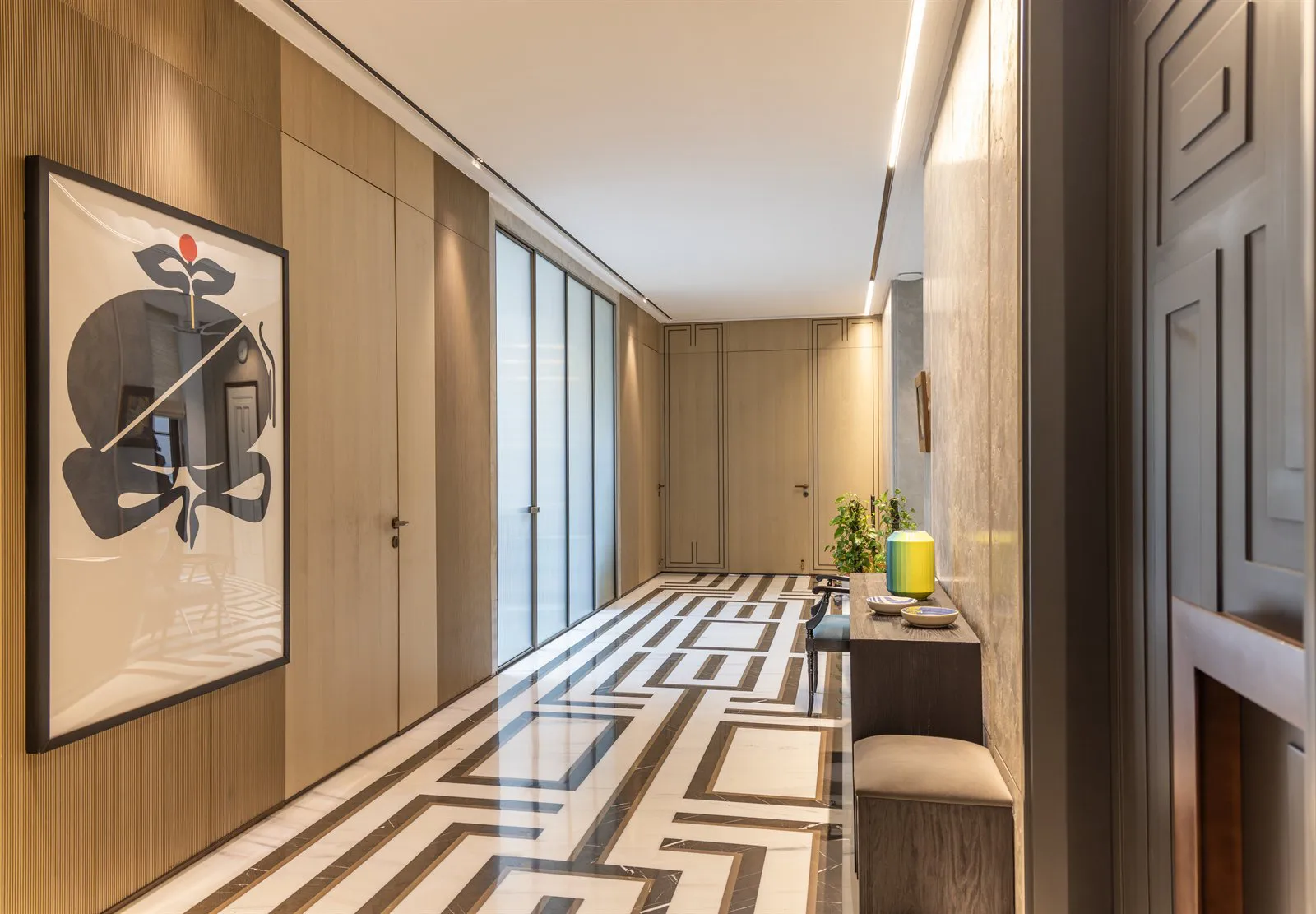 Panelled corridor with fluted oak walls and an inlaid marble floor