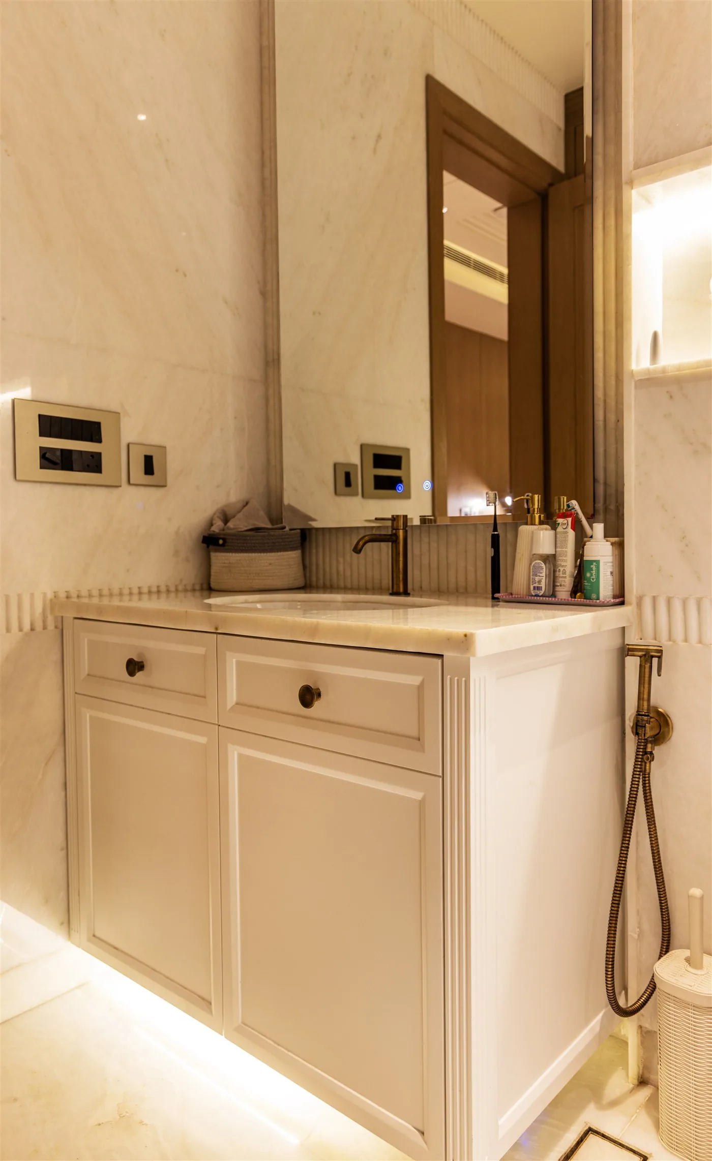 Marble bathroom with panelled vanity — 601, Camellias