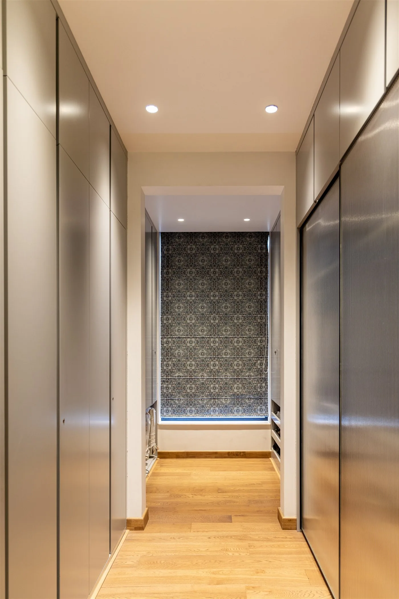 Utility corridor with full-height storage — Gulmohar Park