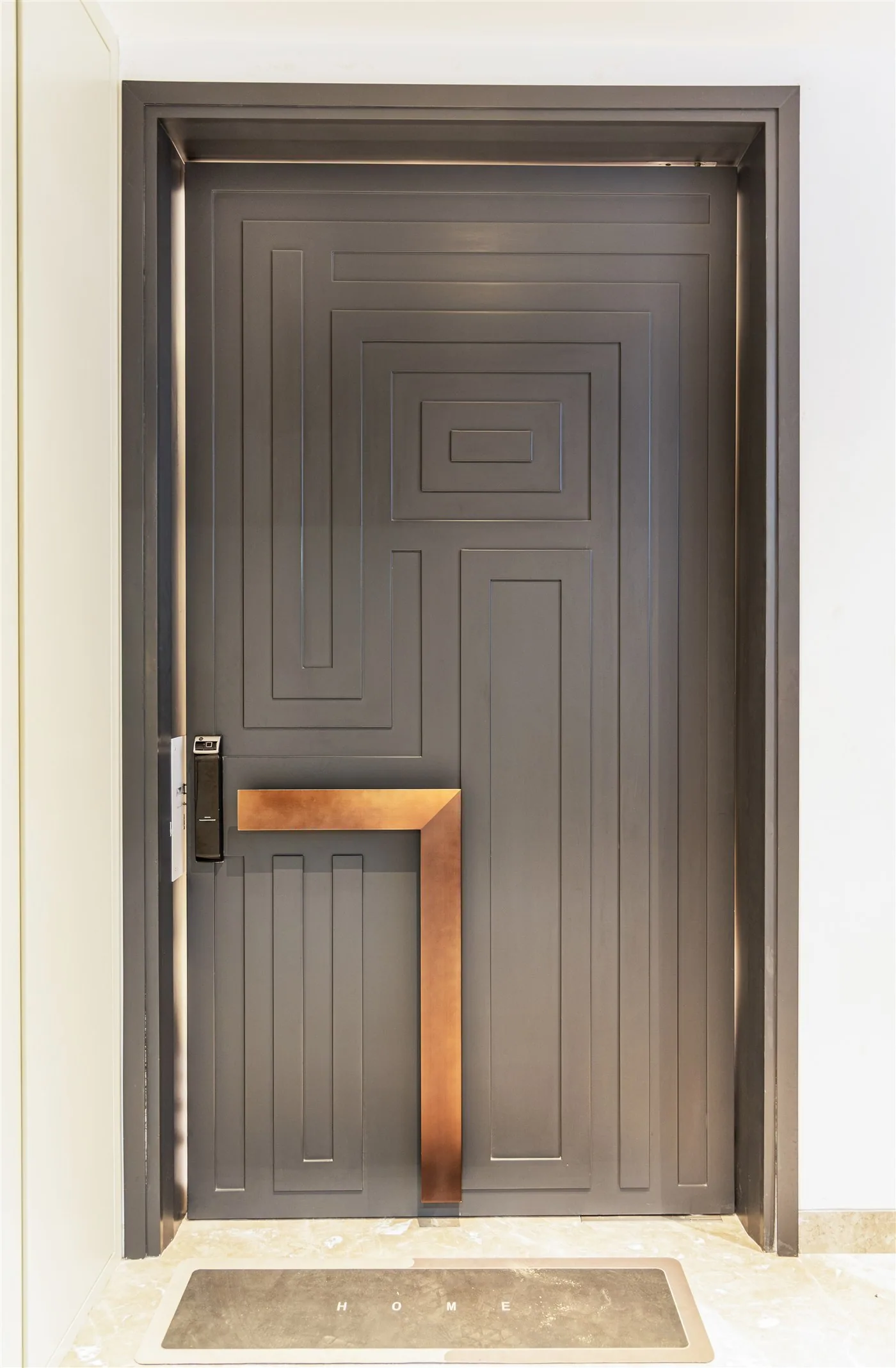 Bronze entrance door with geometric panelling — Gulmohar Park